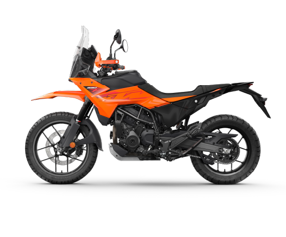 Side profile of 2025 KTM 390 Adventure X in Electronic Orange, showing its sharp design and alloy wheels